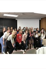 Members from the Women in Economics (WE) student organization at UW-Madison pose with Chancellor Rebecca Blank for a group photo.
